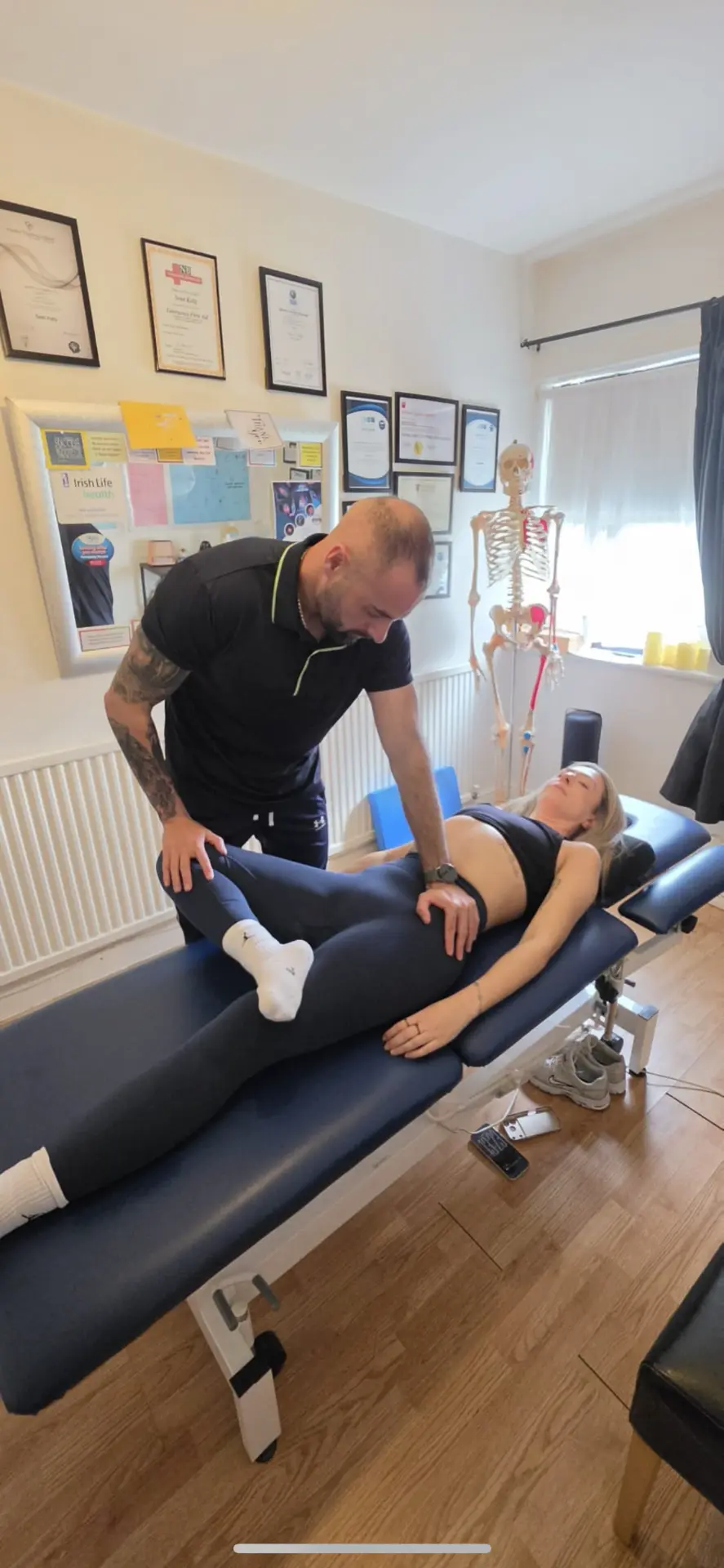 Sean Kelly assessing a client's hip and pelvis at Better Life Ireland